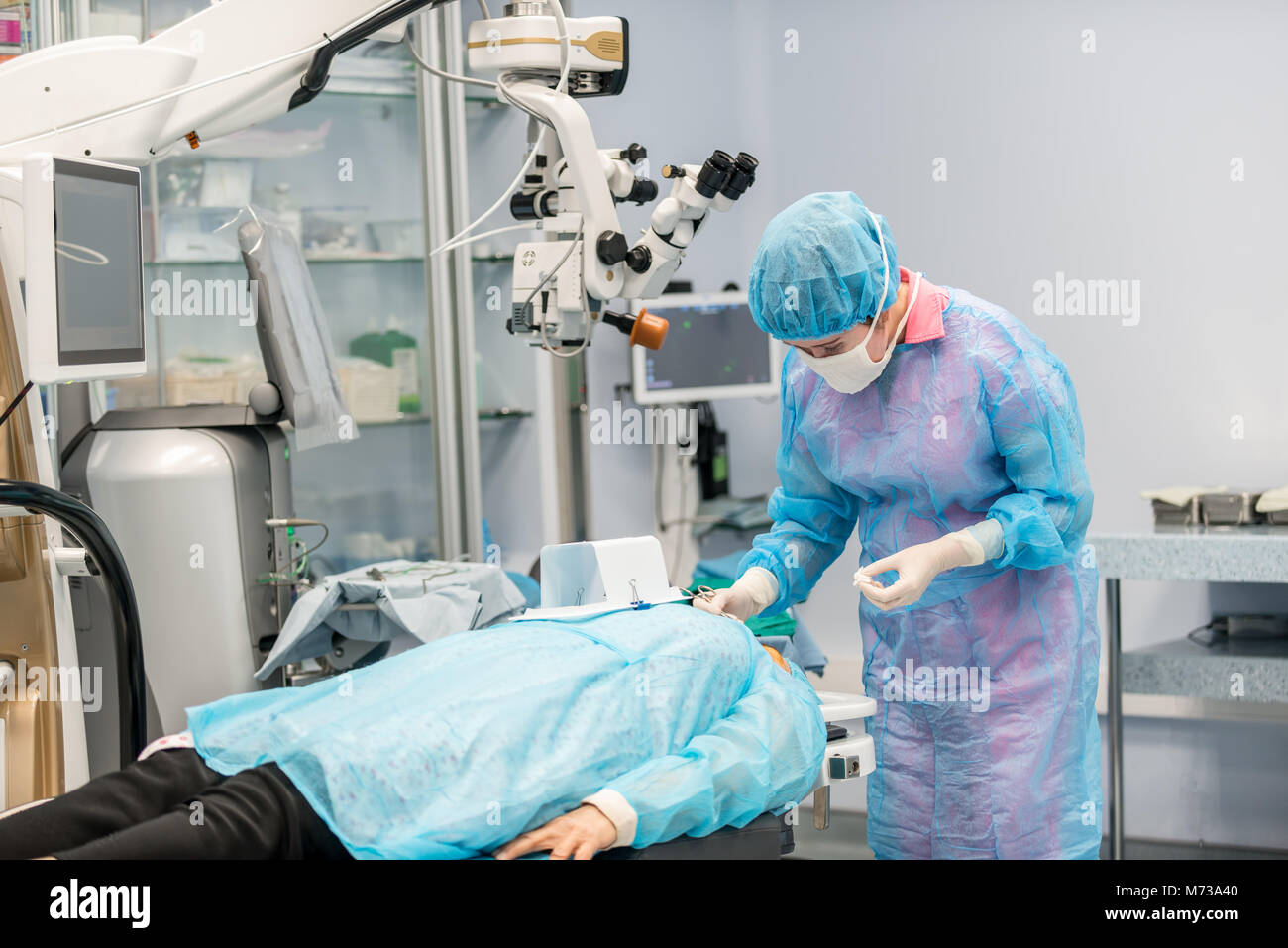 eye surgeons perform surgery on the patient. surgeons at work. medical conceptions Stock Photo