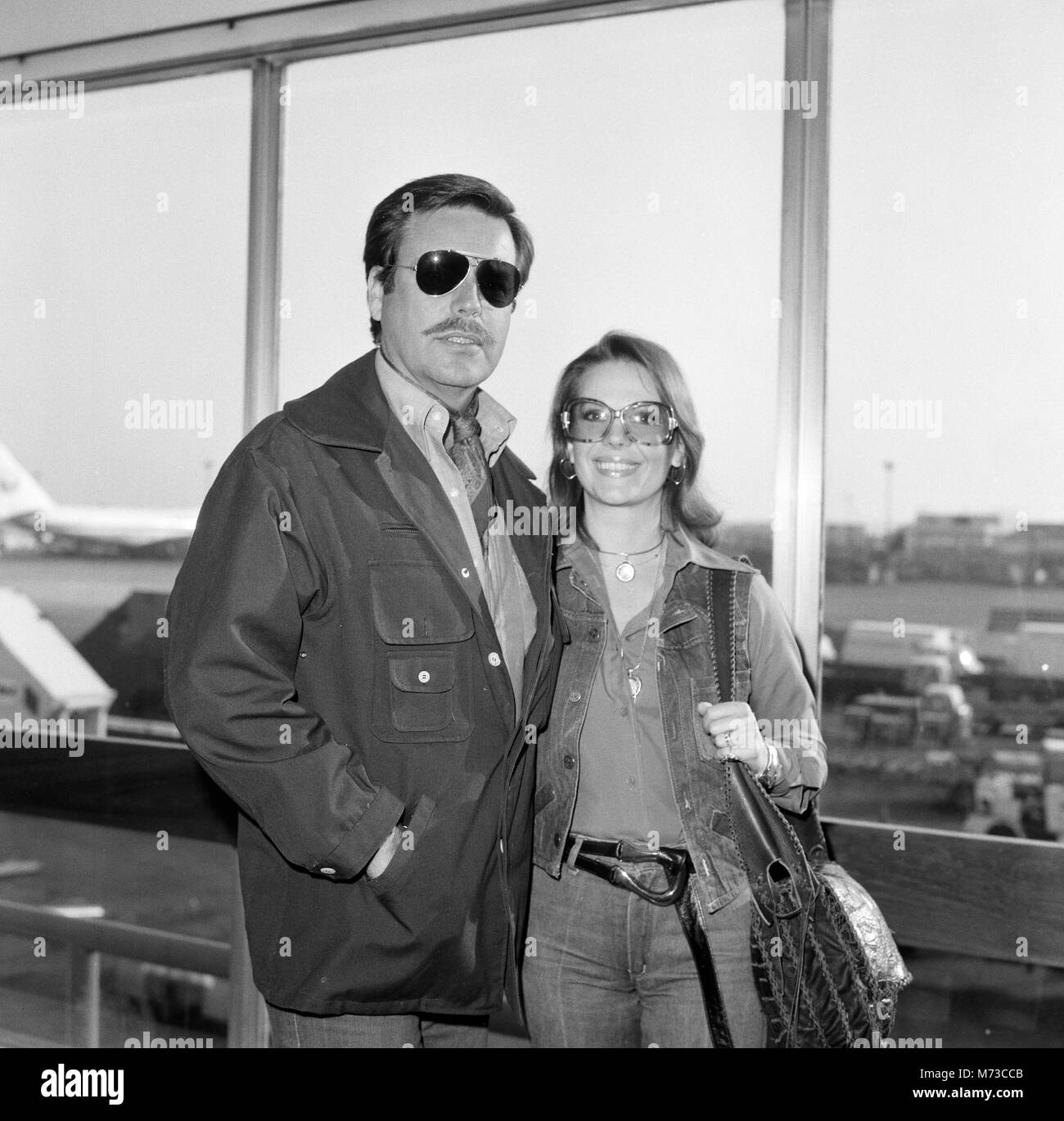 Actor Robert Wagner and actress wife Natalie Wood arriving in London en route for the South of France for a short holiday before returning to London next month to make TV production of the Tennessee Williams play 'Cat on a Hot Tin Roof' for Granada. The play will be produced by Lord Olivier who also plays Big Daddy in the play. Natalie said on arrival from LA 'Its a very exciting prospect'. Before starting on the play they will fly back to Hollywood to collect their two children, Natasha, 5, and Cassandra, 2. 24th April 1976. Stock Photo