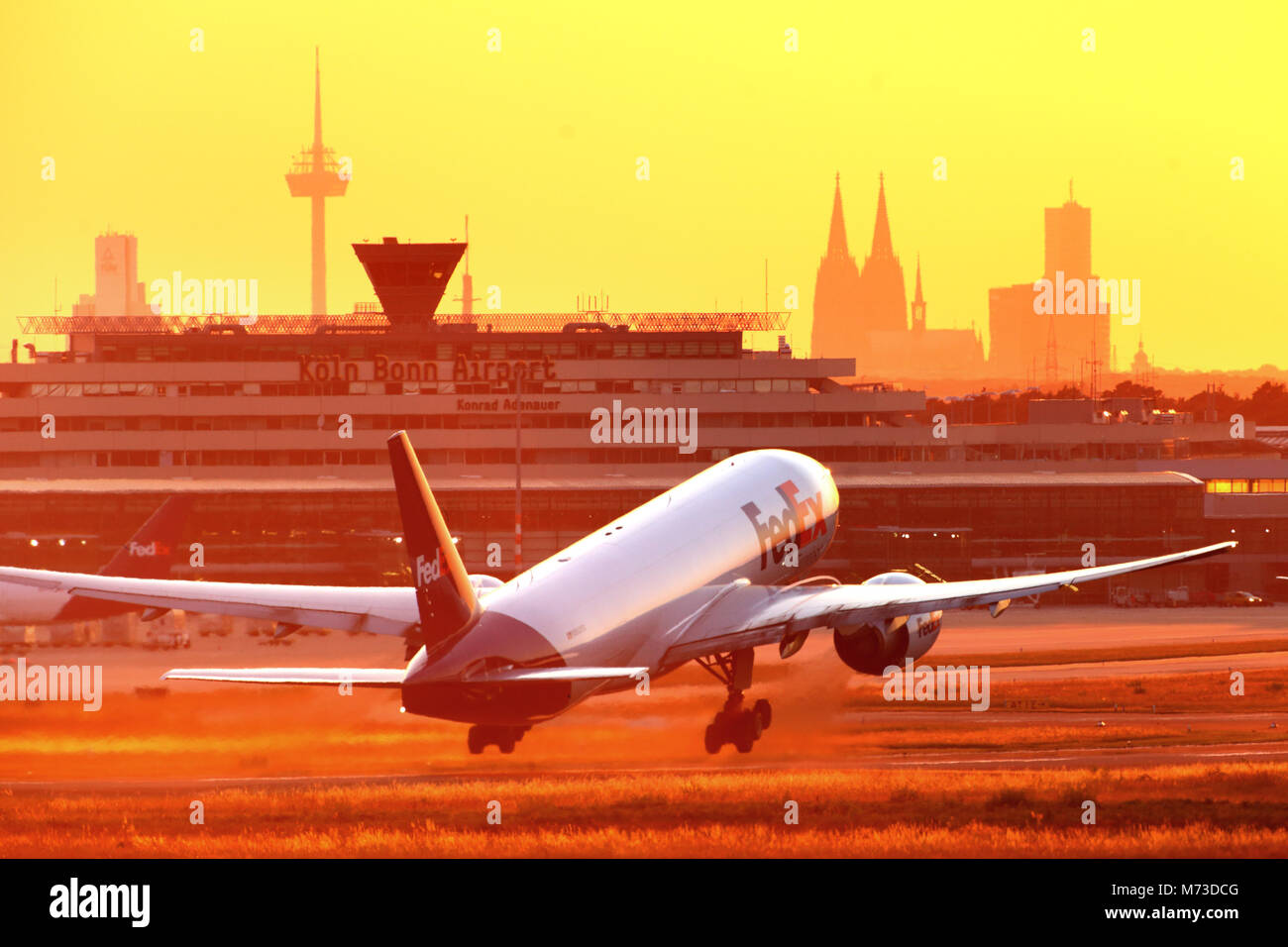 Plane taking off at Cologne/Bonn Airport before sunset Stock Photo