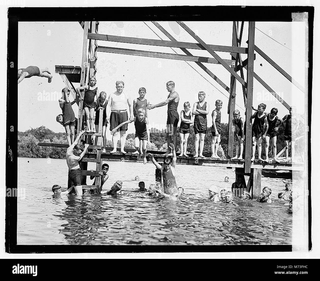 A photograph of an individual named Davis swimming at Moosehead, a likely reference to Moosehead Lake in Maine. This image showcases recreational swimming in a natural, outdoor setting. Stock Photo