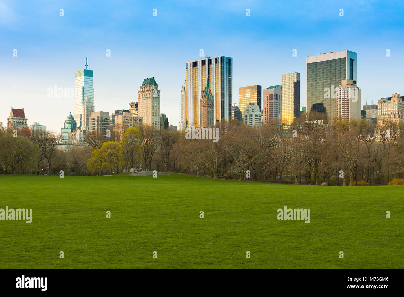 Sheep Meadow at Central Park and Midtown skyline, New York City, NY, USA Stock Photo