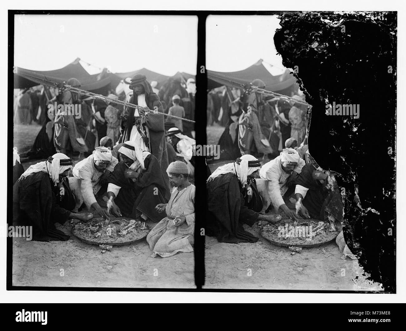 This image depicts a feast held after a locust plague, which caused severe agricultural damage. The gathering represents a moment of recovery and community support following the disaster. Stock Photo
