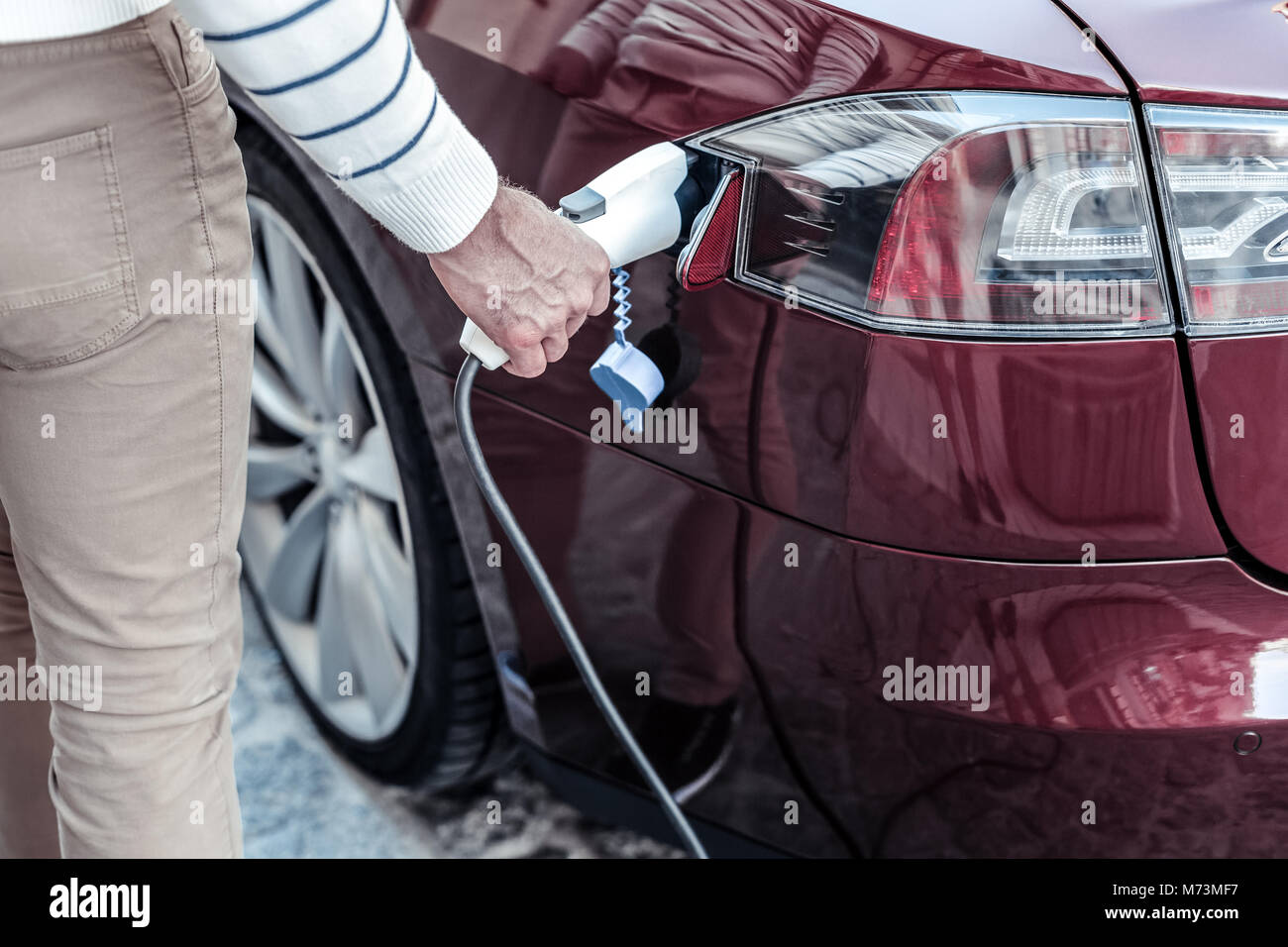 Petrol nozzle being put into the car Stock Photo Alamy