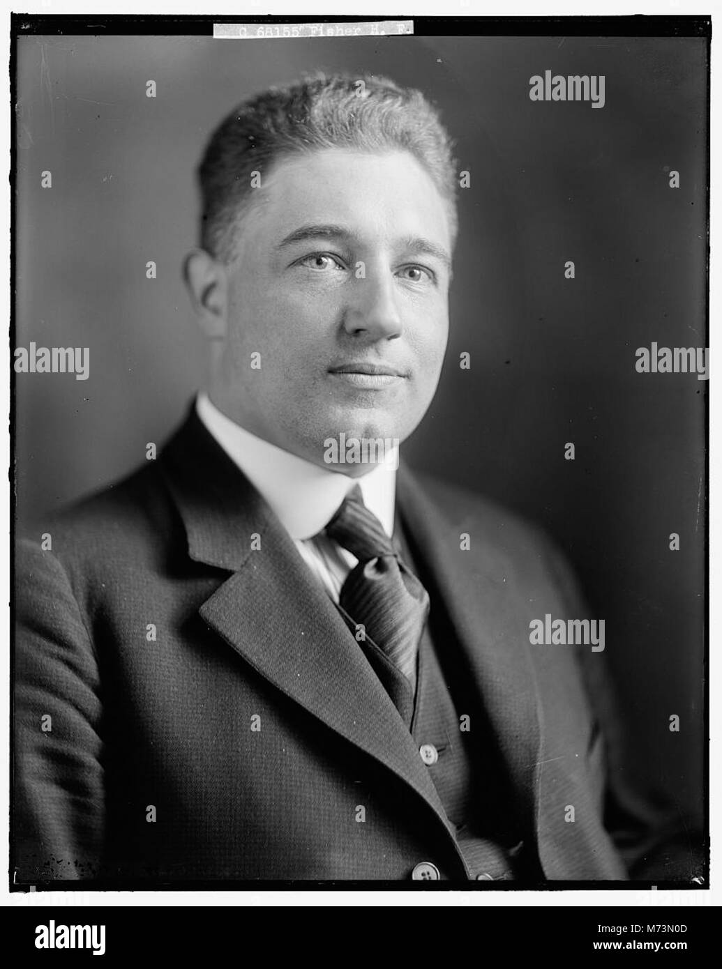 A portrait of H.F. Fisher, capturing his professional image as an ...
