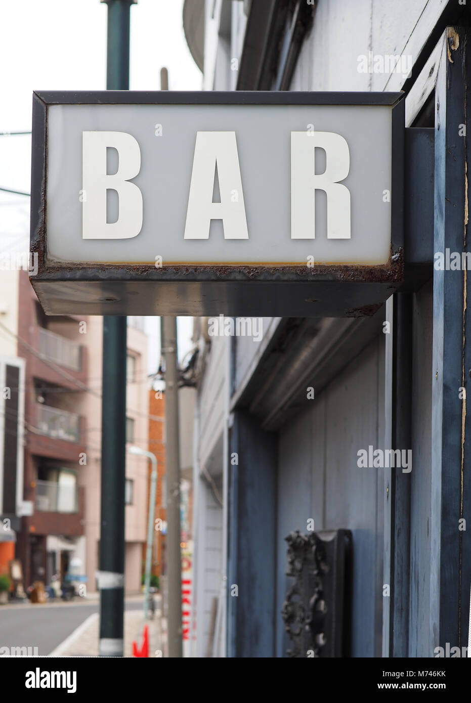 Generic inner city vibe BAR sign oozing character. Stock Photo