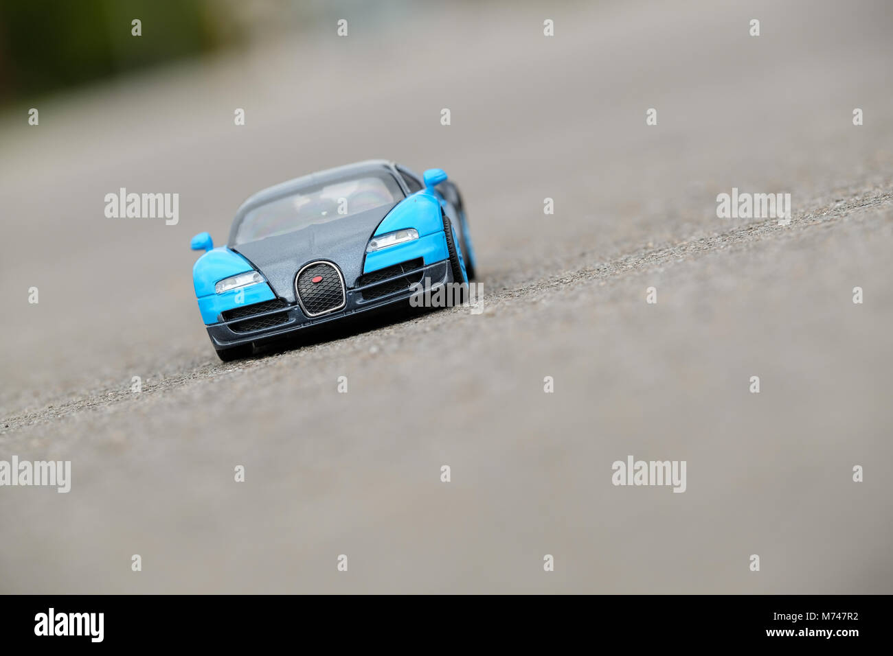 Bugatti Veyron Blue Model Children's Toy Car on Asphalt Road Stock