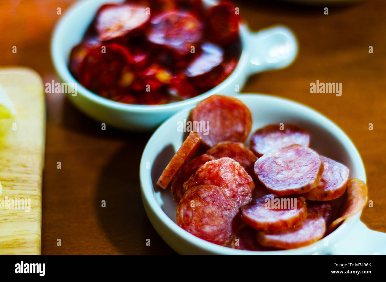 set of traditional Spanish sausages, side dishes of thinly sliced