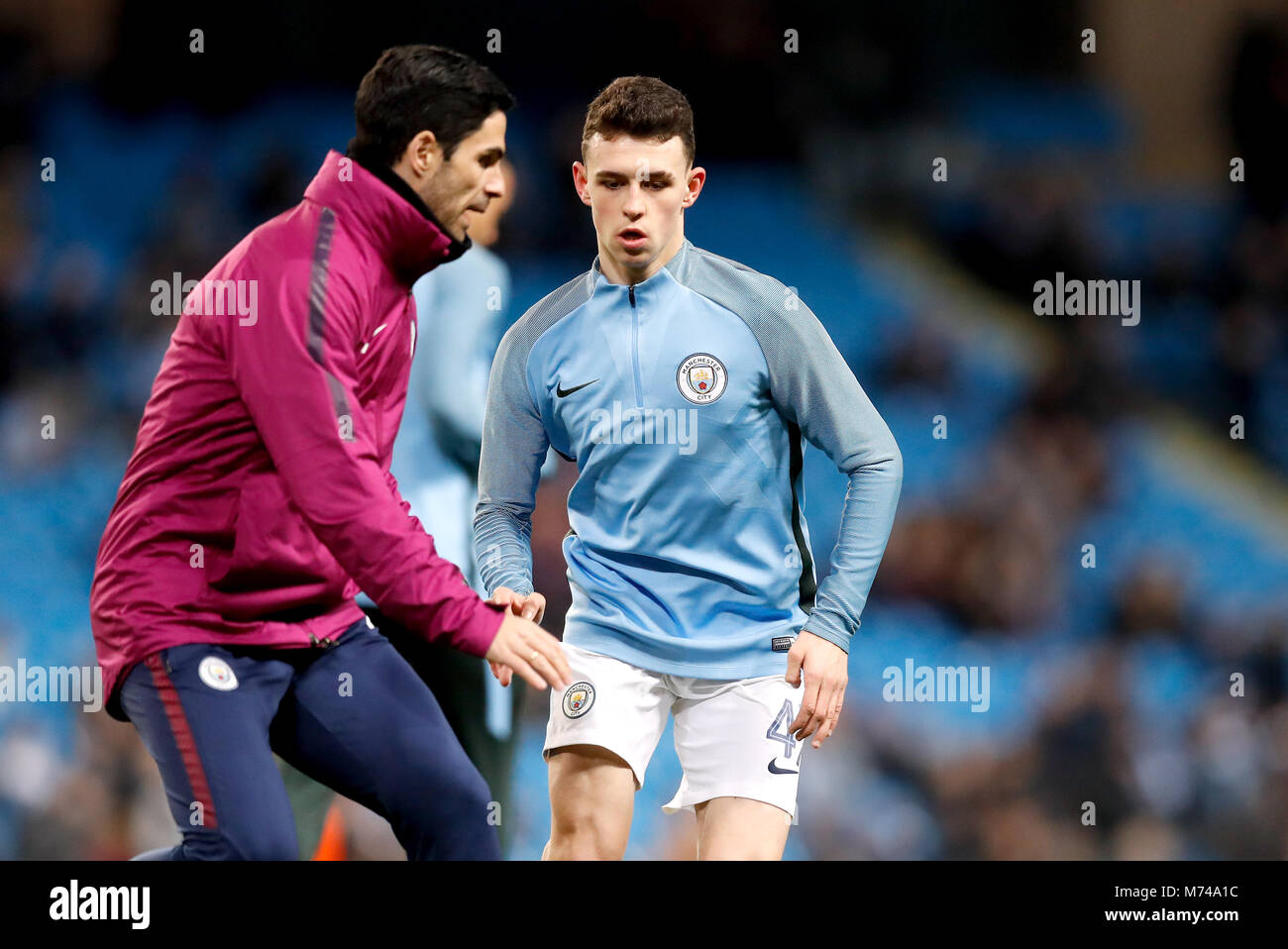 manchester-citys-phil-foden-right-and-assistant-coach-mikel-arteta-M74A1C.jpg