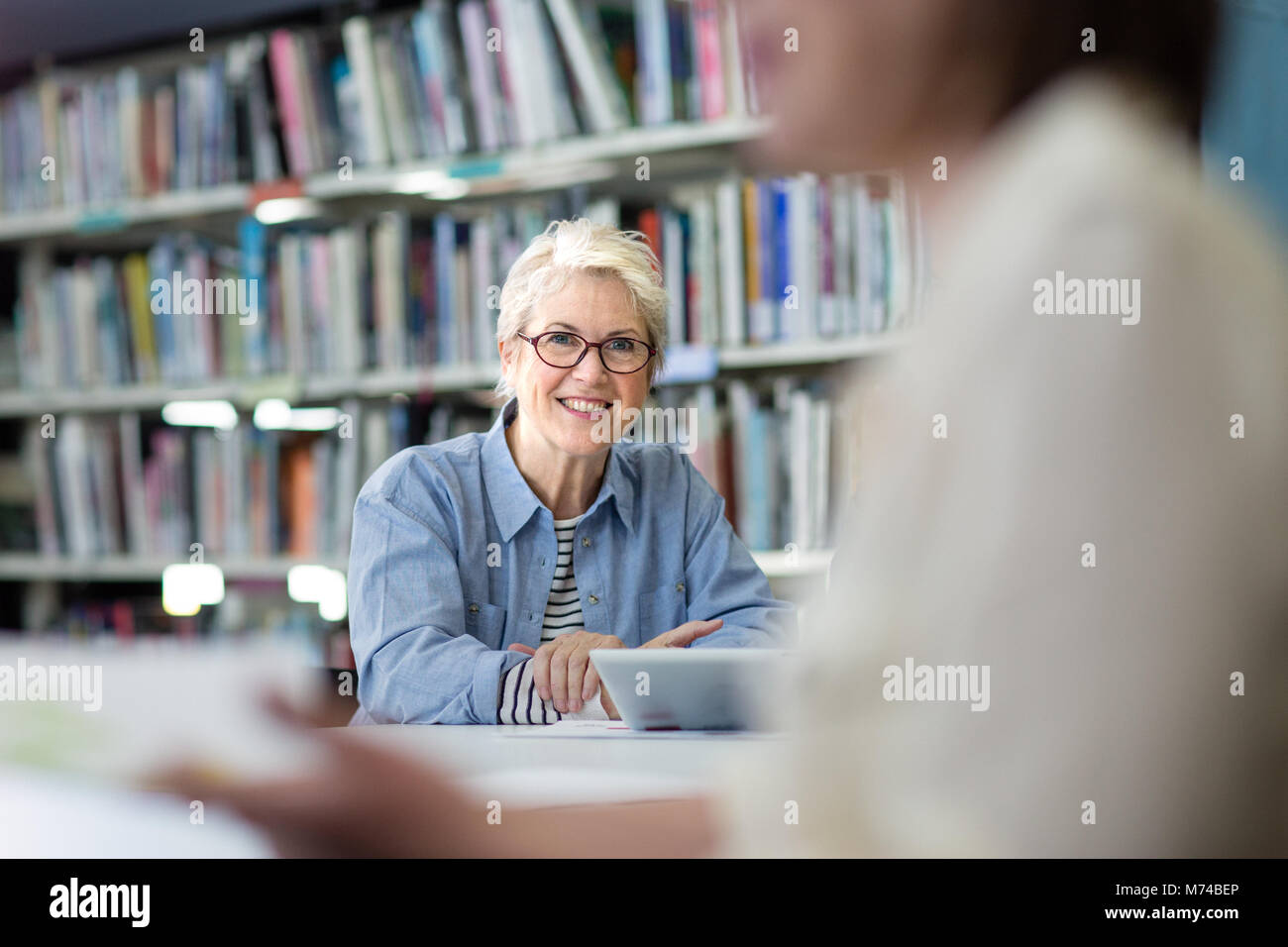 Portrait of mature student in college library Stock Photo
