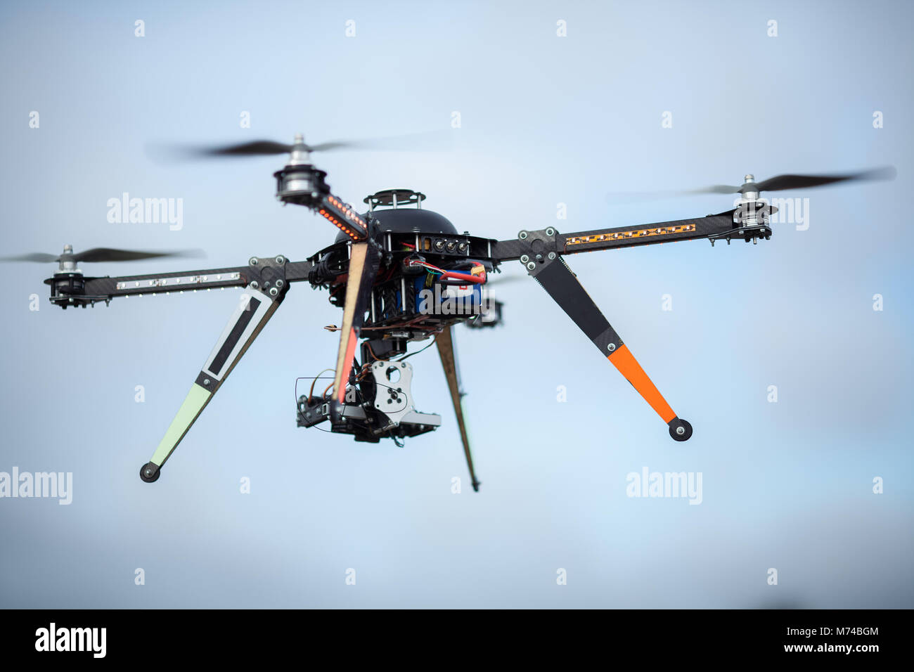 Big Carbon Drone dslr dji summer in the air with gimbal RC RX with  propellers Stock Photo - Alamy