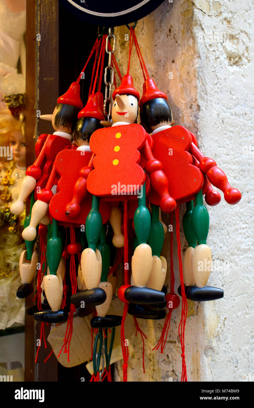Wooden Pinocchio Puppets on sale outside Venetian Souvenir Shop Stock Photo