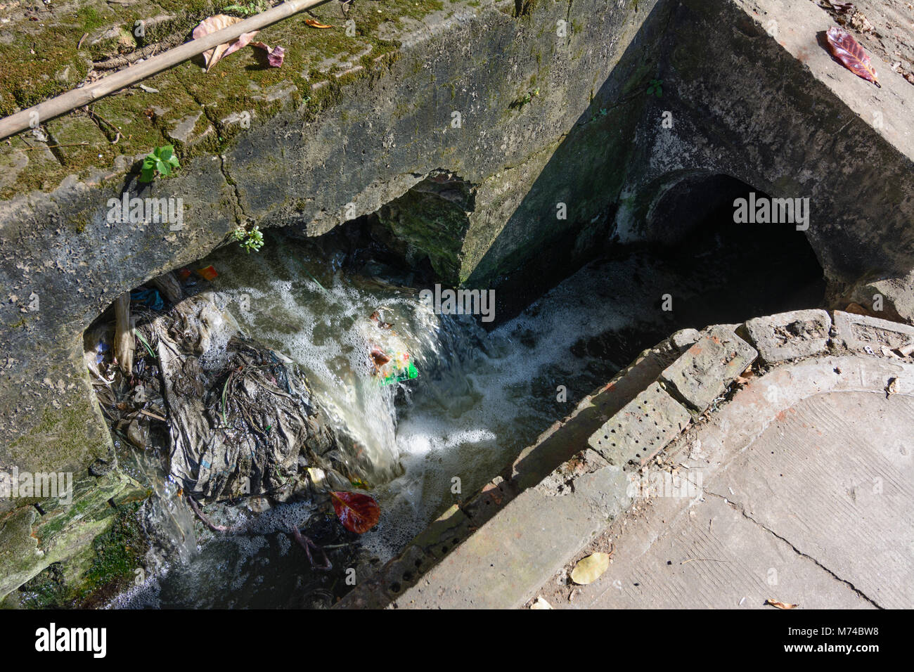 Yangon (Rangoon): open sewer with trash, Colonial Quarter, Yangon Region, Myanmar (Burma) Stock Photo