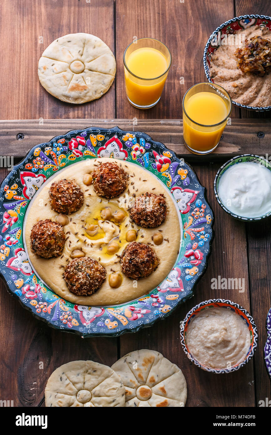 Hummus with falafel and pita in traditional plate Stock Photo - Alamy