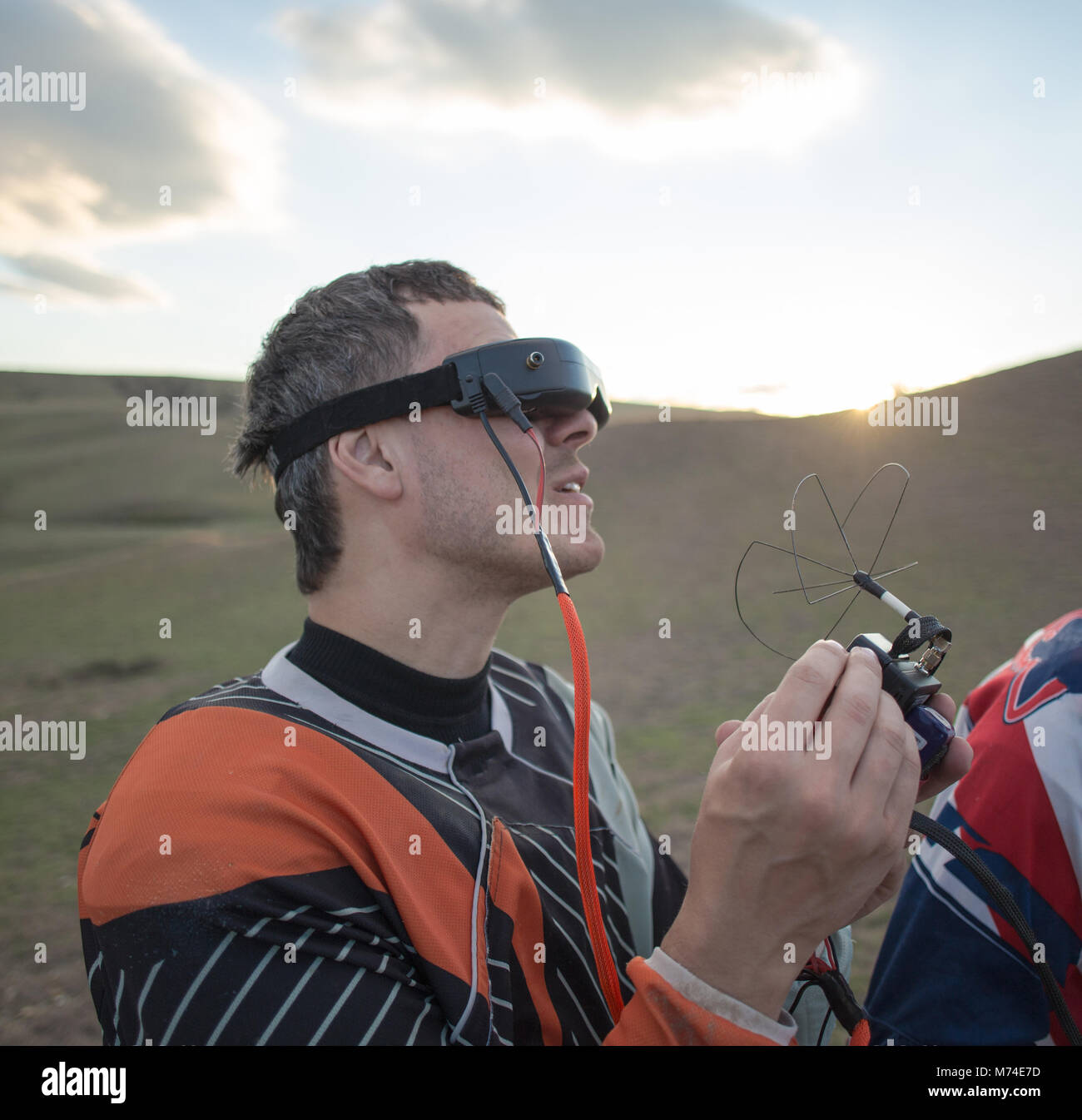 Drone operator googles man control camera antenna Stock Photo Alamy