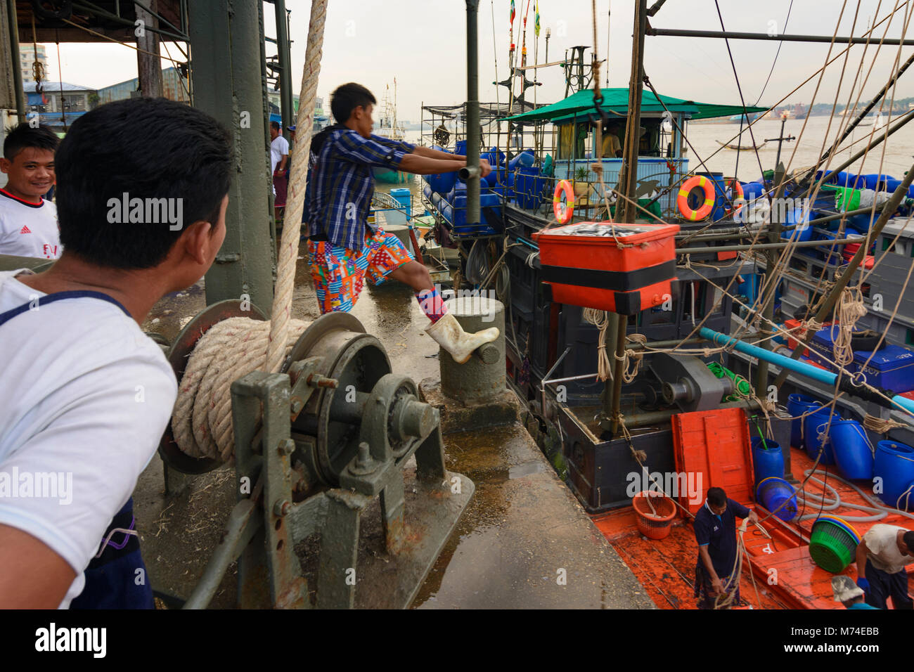 Yangon (Rangoon) San Pya Fish Market unloading fishing ship with