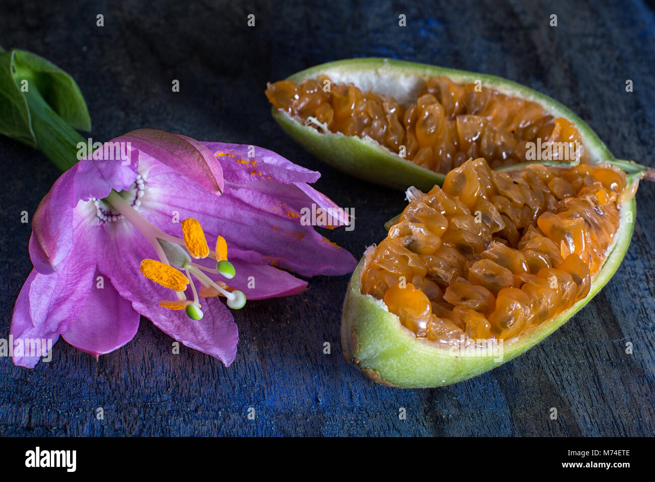 cut passion fruit and flower also known as taxo Stock Photo
