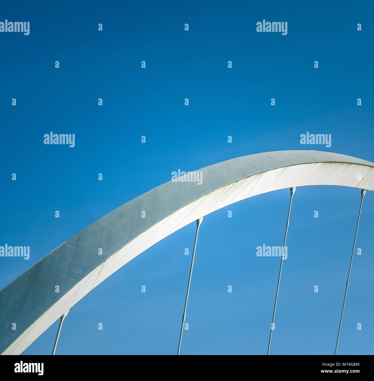 Abstract Architecture Detail Of A Section Of A Suspension Bridge With Blue Sky And Copy Space Stock Photo