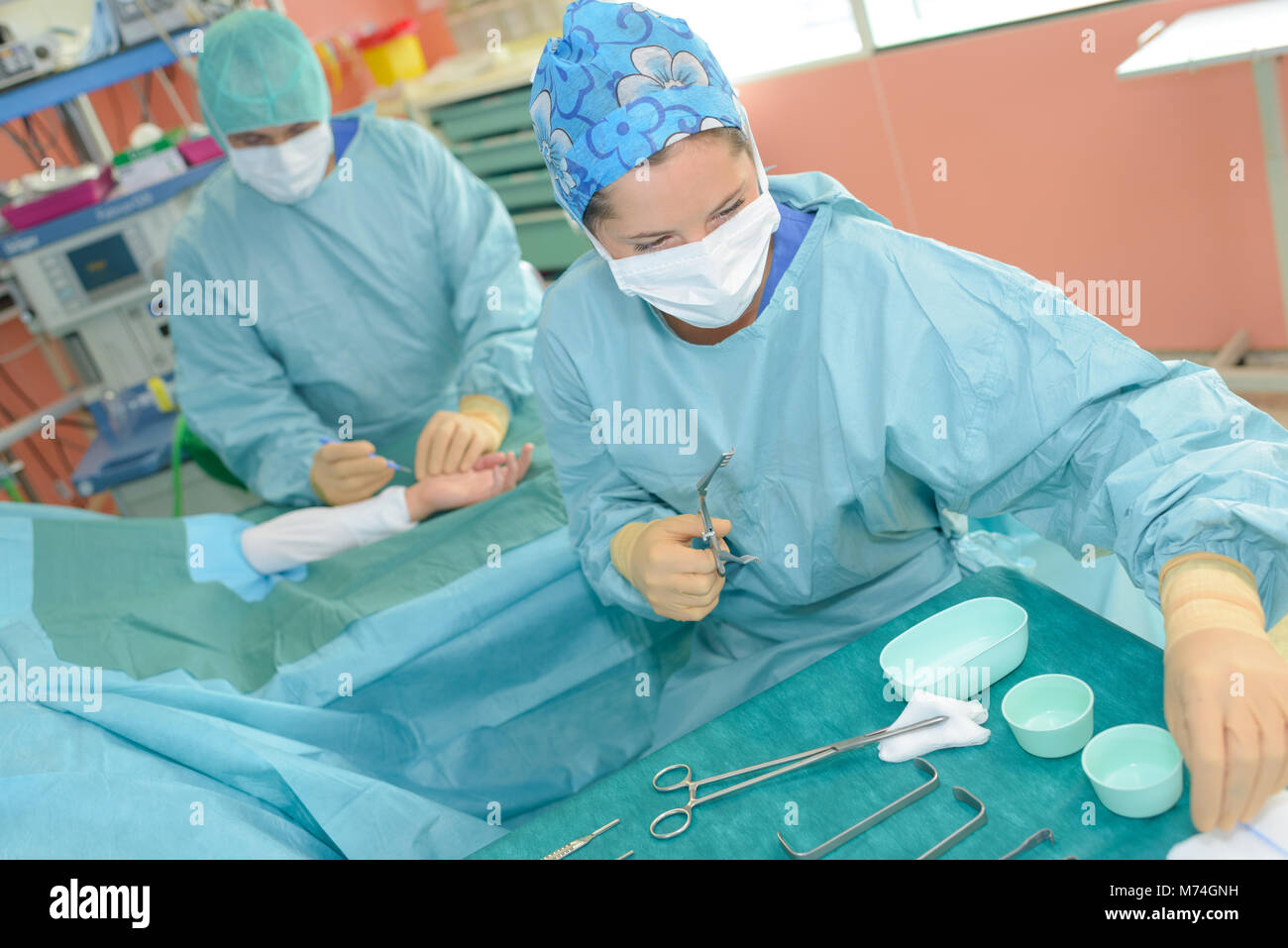 scrub nurse preparing tools for operation Stock Photo Alamy