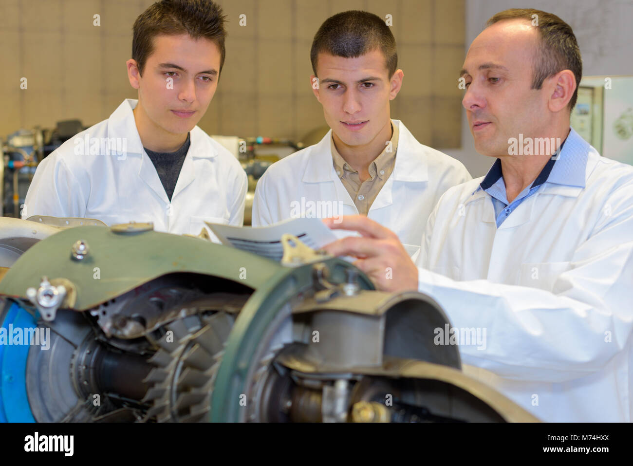 engineer working with apprentices Stock Photo - Alamy