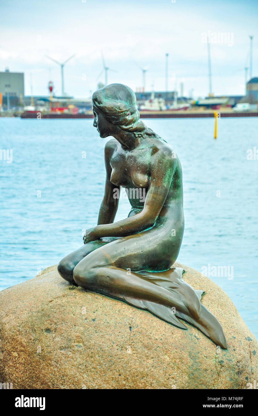 COPENHAGEN, DENMARK - APRIL 20, 2012 - The Little Mermaid bronze statue displayed on a rock by the waterside at the Langelinie promenade in Copenhagen Stock Photo