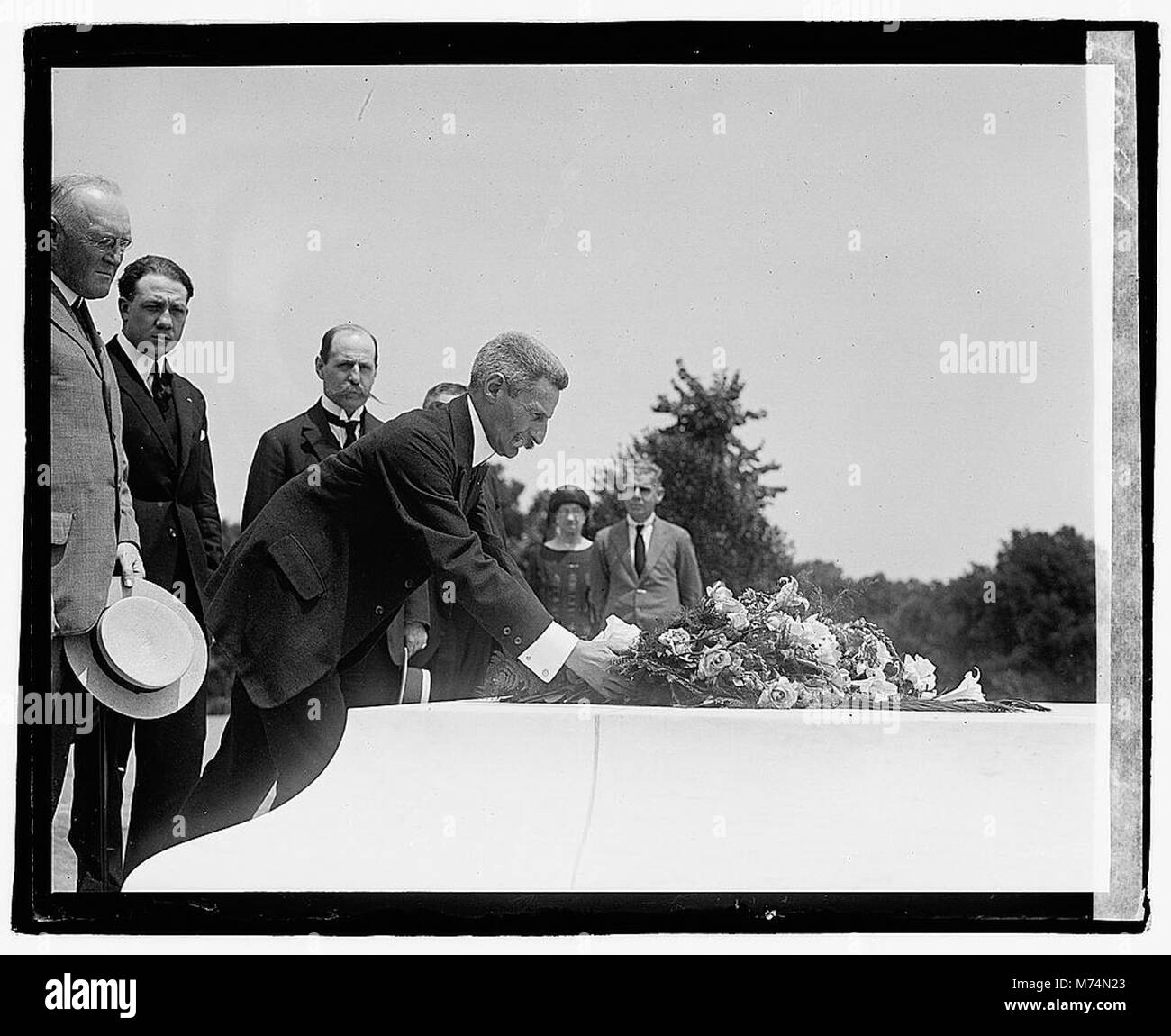 General Gaston Gassouin, former chief of staff of the French army, honors America’s unknown soldier by placing a wreath at Arlington National Cemetery on June 16, 1922. Stock Photo