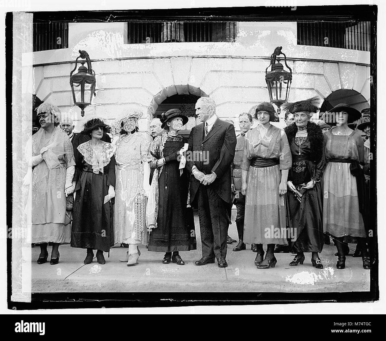 A historical photograph showing President Warren G. Harding with Marie Curie, captured on May 20, 1921, reflecting a moment between the two prominent figures. Stock Photo