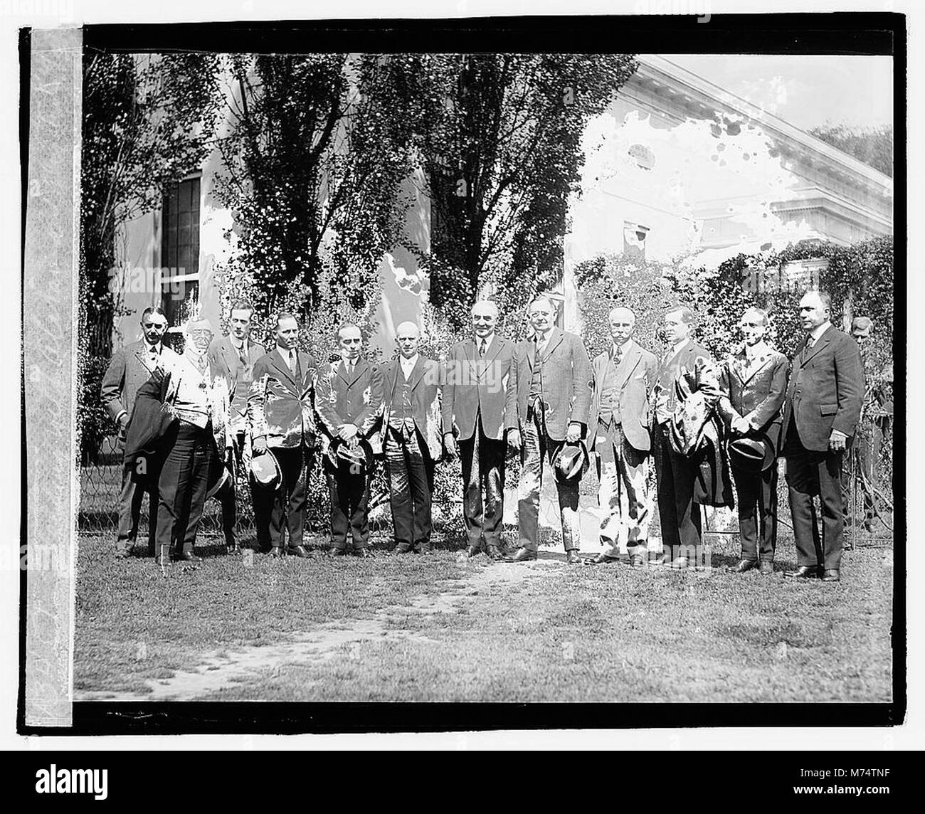 A photograph of President Warren G. Harding with Alabama delegates on April 20, 1921, documenting his interaction with political figures. Stock Photo