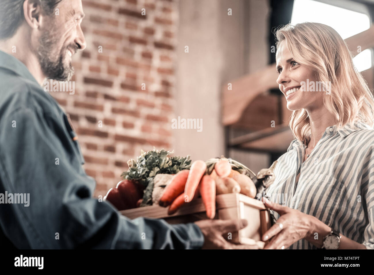 Positive food delivery man courier hi-res stock photography and images ...