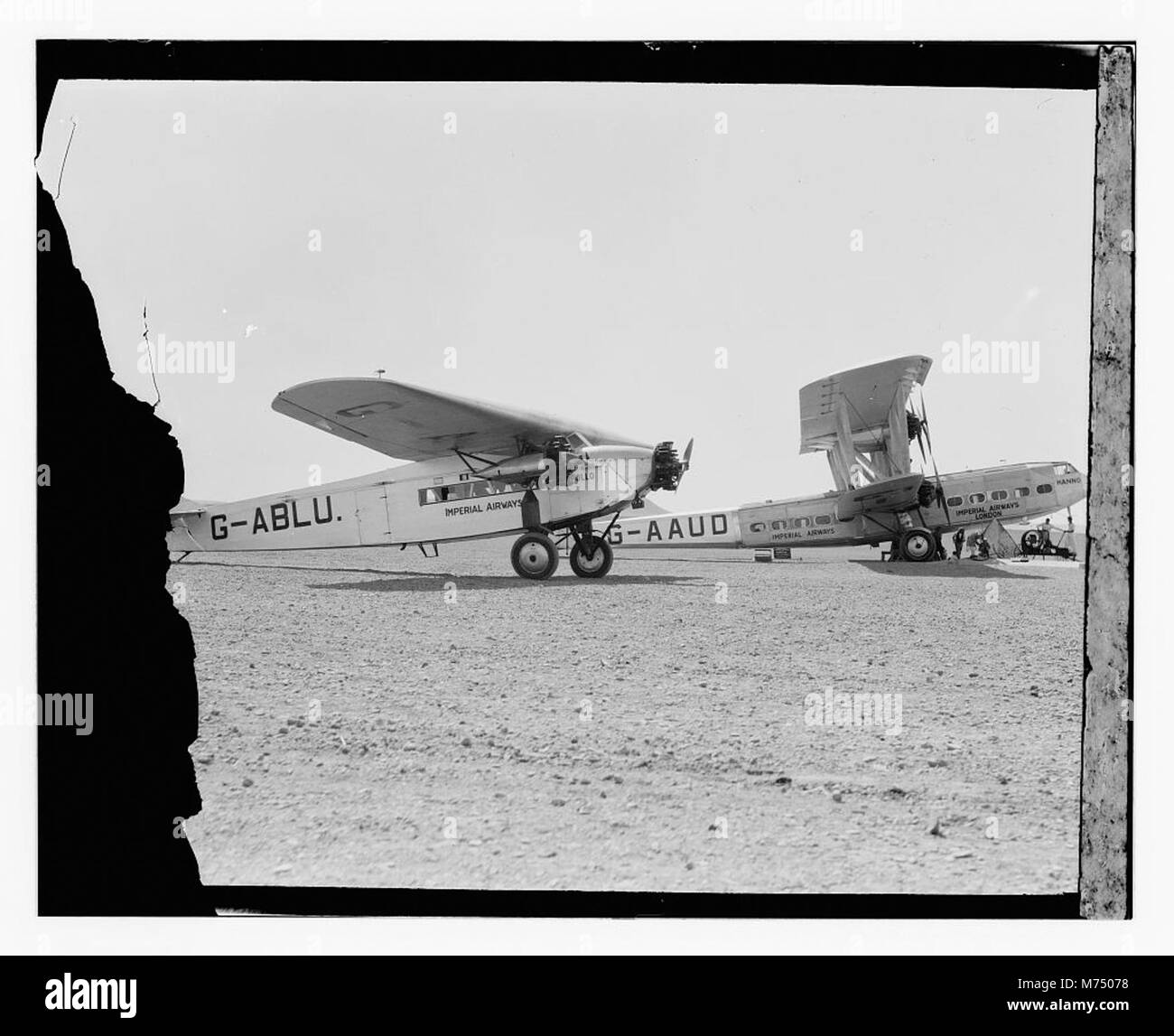 This image shows two Imperial Airways airplanes, 'Hanno' and 'Apollo,' in flight. These early airliners played a significant role in the development of international air travel. Stock Photo