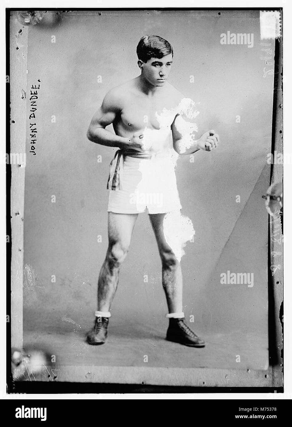 A portrait of Johnny Dundee, a notable figure in the world of boxing. Known for his achievements in the sport during the early 20th century, this image captures his persona. Stock Photo