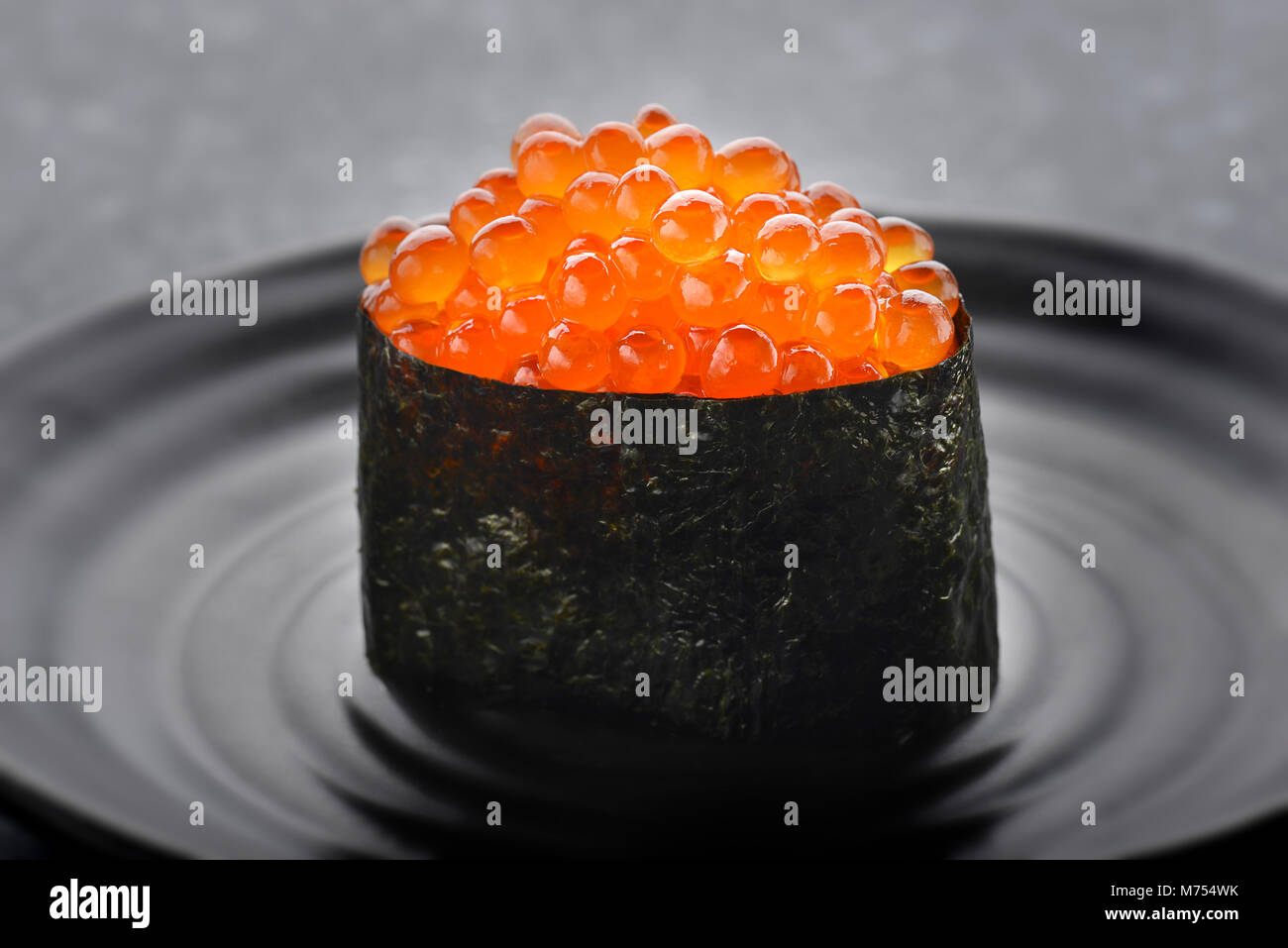 Salmon eggs or Ikura in Japanese style sushi fresh from raw salmond fish in  studio lighting Stock Photo - Alamy