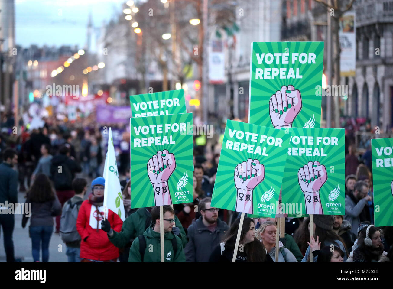 People carrying various signs, as participants take part in a march through Dublin city centre calling for the repeal of the 8th amendment to the Irish constitution. Stock Photo