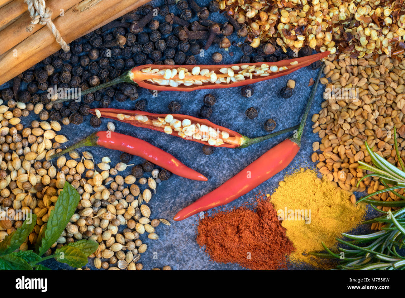 Chilli Peppers and Spices used to add flavor when cooking. Stock Photo