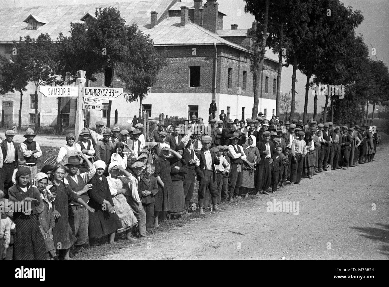 1939 WW2 Crowd of Local People line the steets near Sambor in Poland watching the German invasion 1939 WW2. Sambor is now Ukrainian Stock Photo