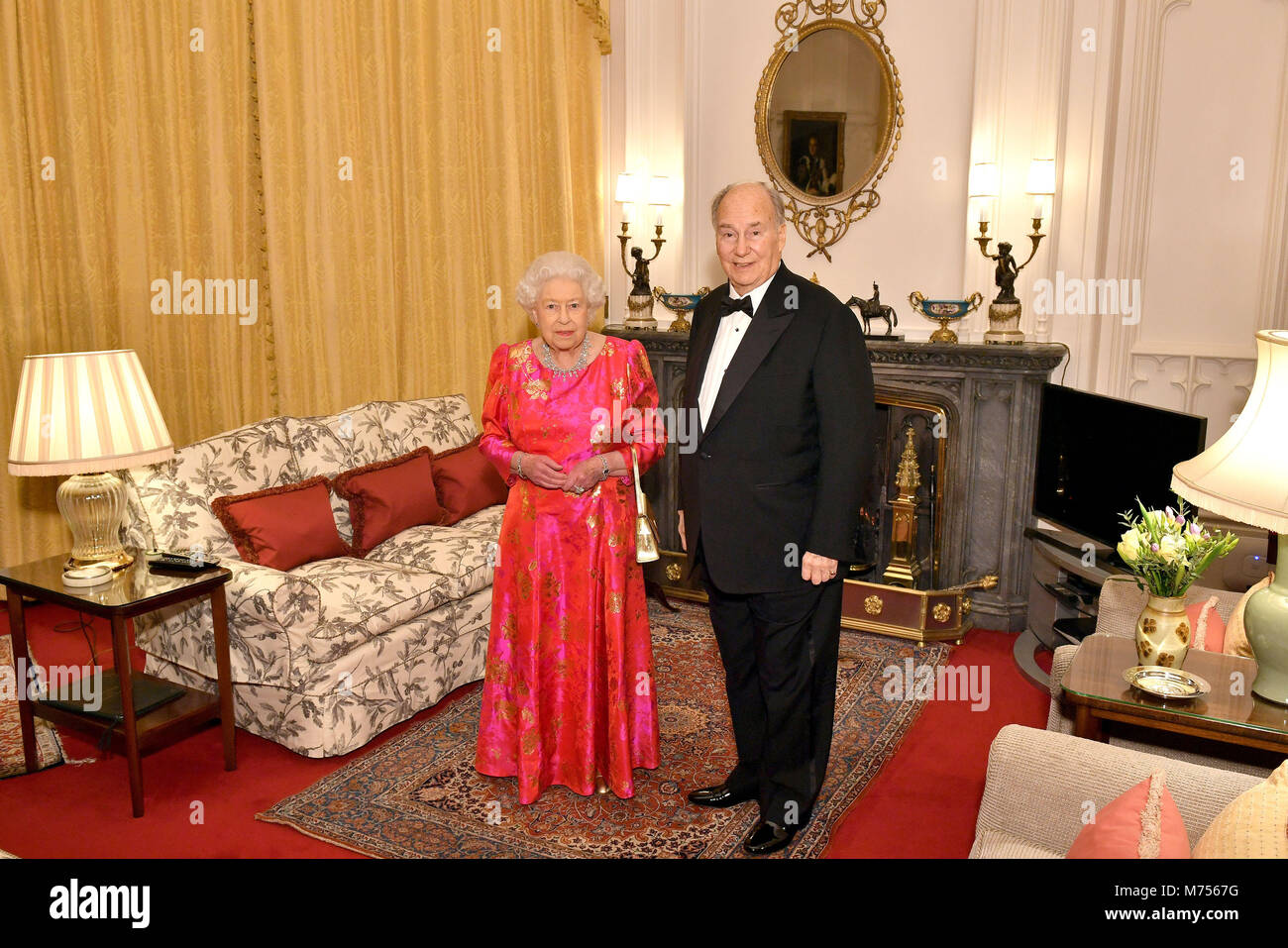 The Queen Elizabeth II and the Aga Khan in the Oak Room at Windsor Castle before she hosts a private dinner in honour of the diamond jubilee of his leadership as Imam of the Shia Ismaili Muslim Community. Stock Photo