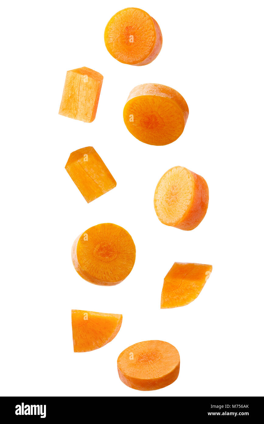 Isolated falling vegetables. Falling carrot isolated on white