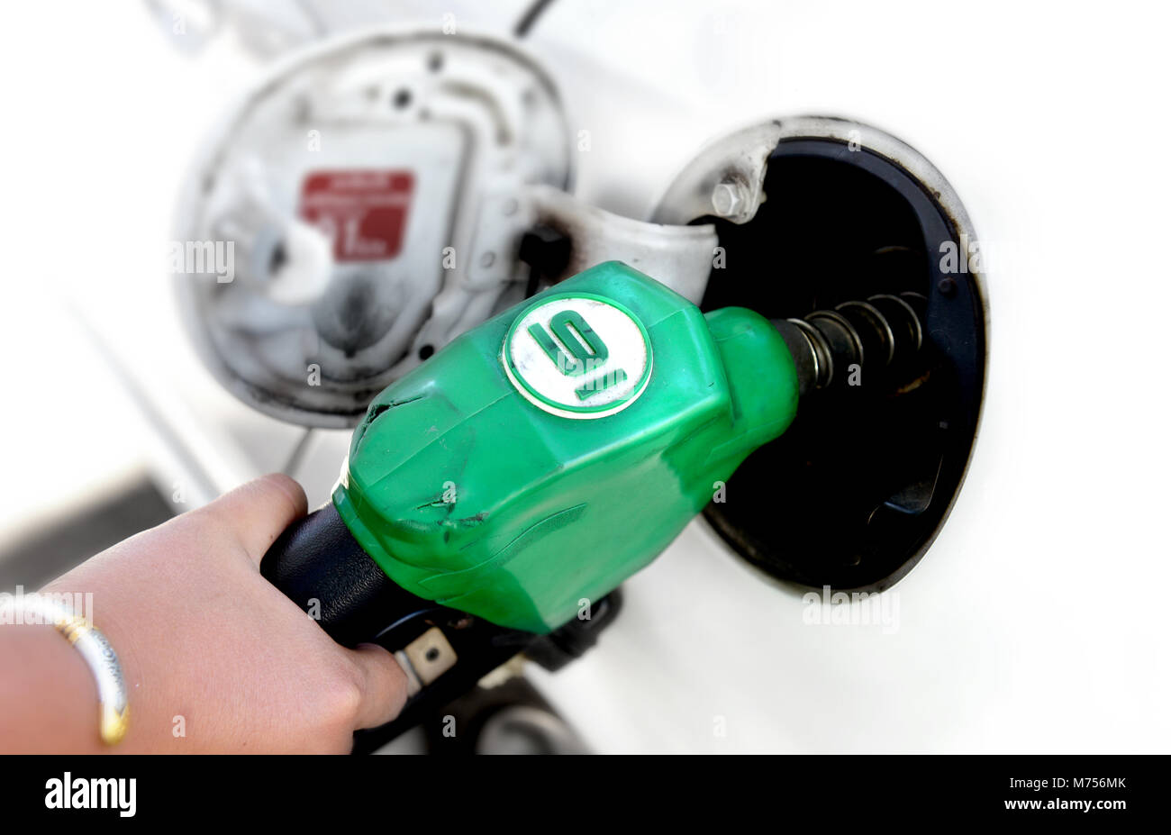 color of fuel nozzle gasoline pump fill time Stock Photo Alamy