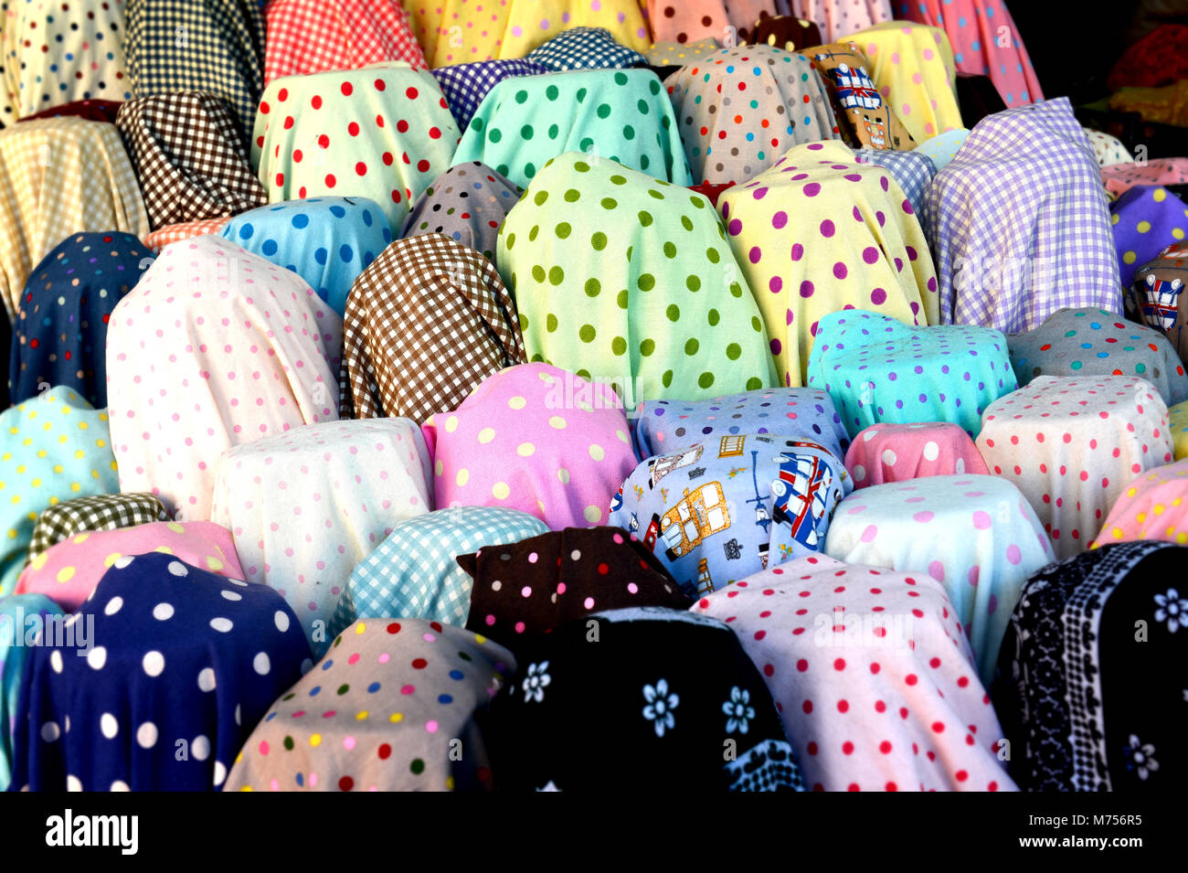 colorful fabric roll for sale at market Stock Photo Alamy