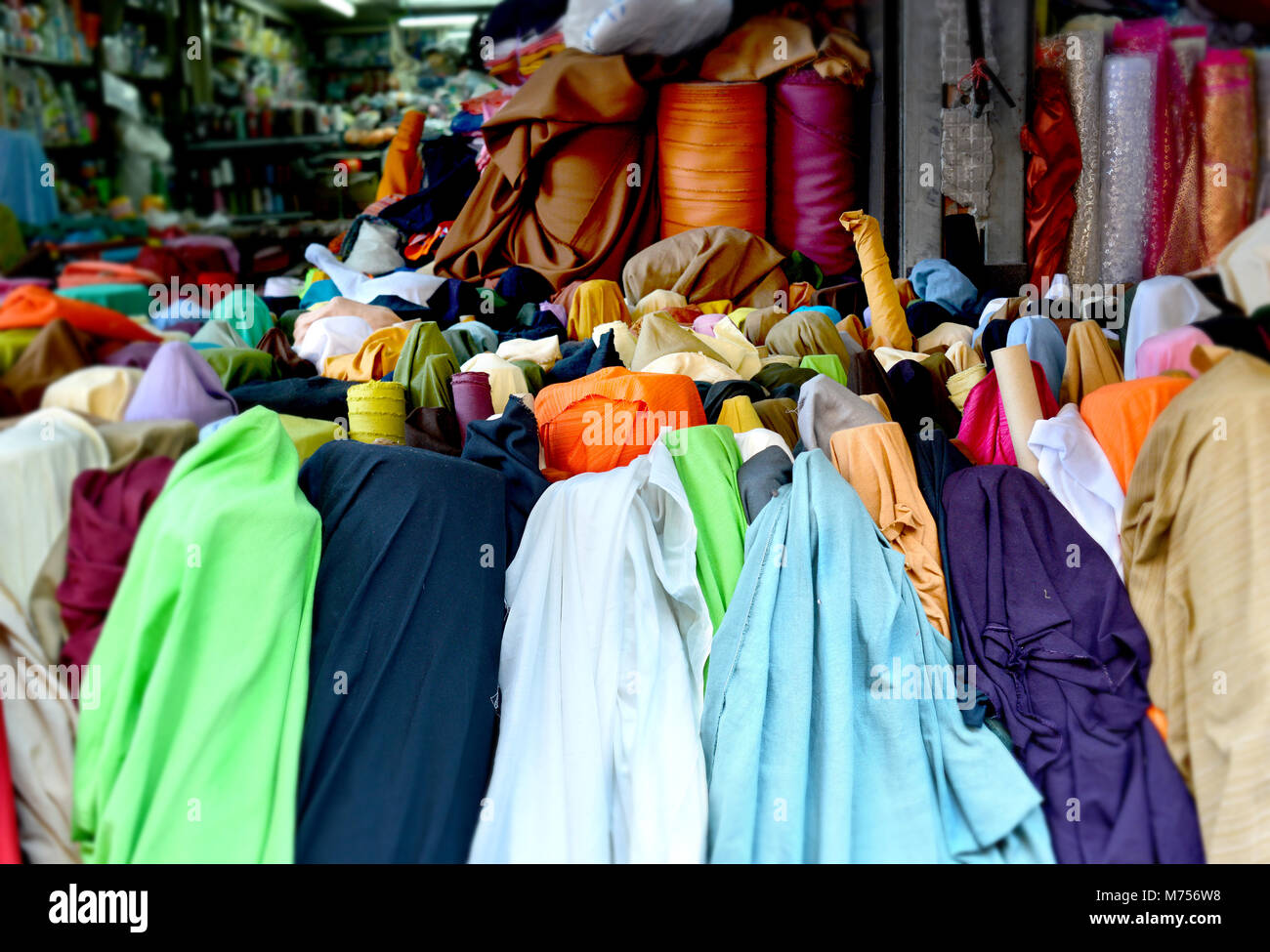 colorful fabric roll for sale at market Stock Photo Alamy