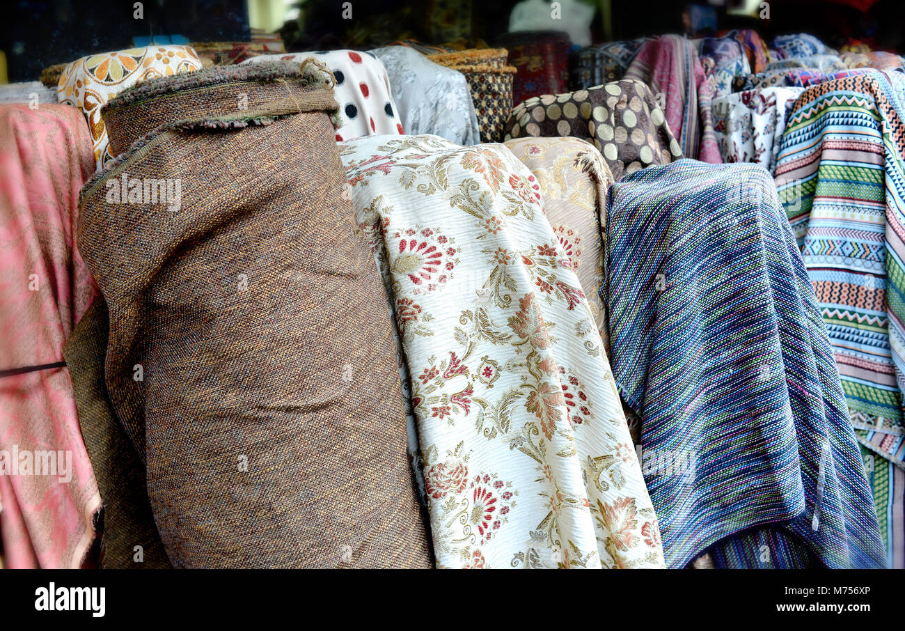 colorful fabric roll for sale at market Stock Photo Alamy