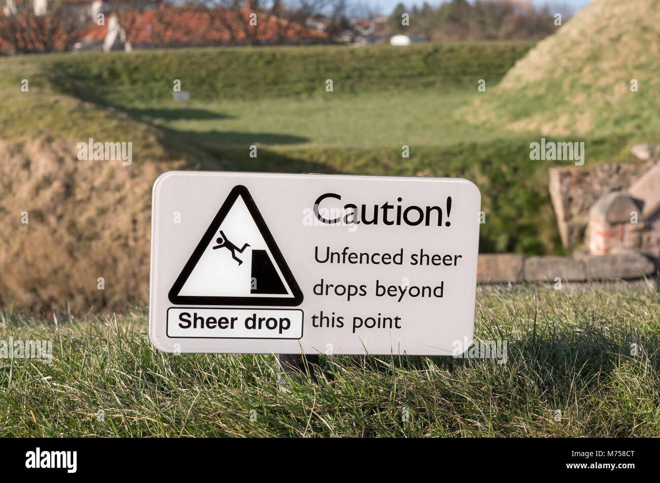 Sign, Unfenced sheer drops, Berwick upon Tweed town walls, Northumberland, England, UK Stock Photo