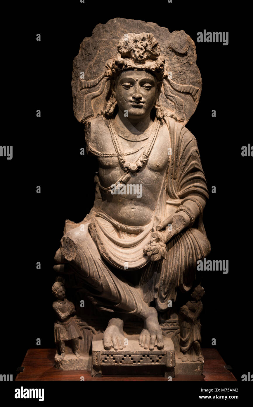 ancient cross-legged Bodhisattva schist statue image in 2nd-3rd century, Kushan dynasty from Mardan, Pakistan. Stock Photo