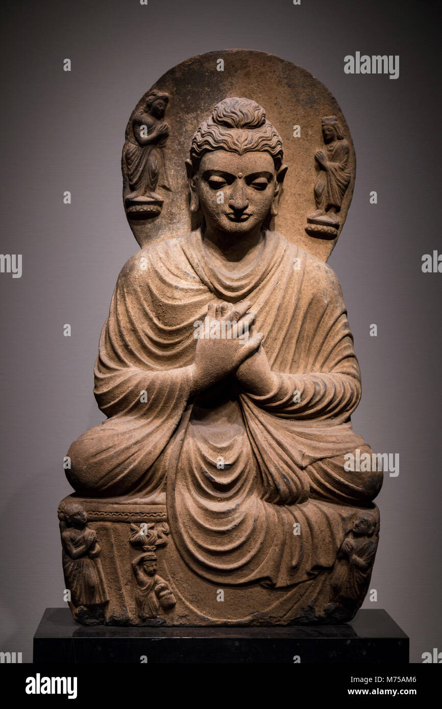 ancient seated Buddha schist statue image in 2nd-3rd century, Kushan dynasty from Gandhara, Pakistan. Stock Photo