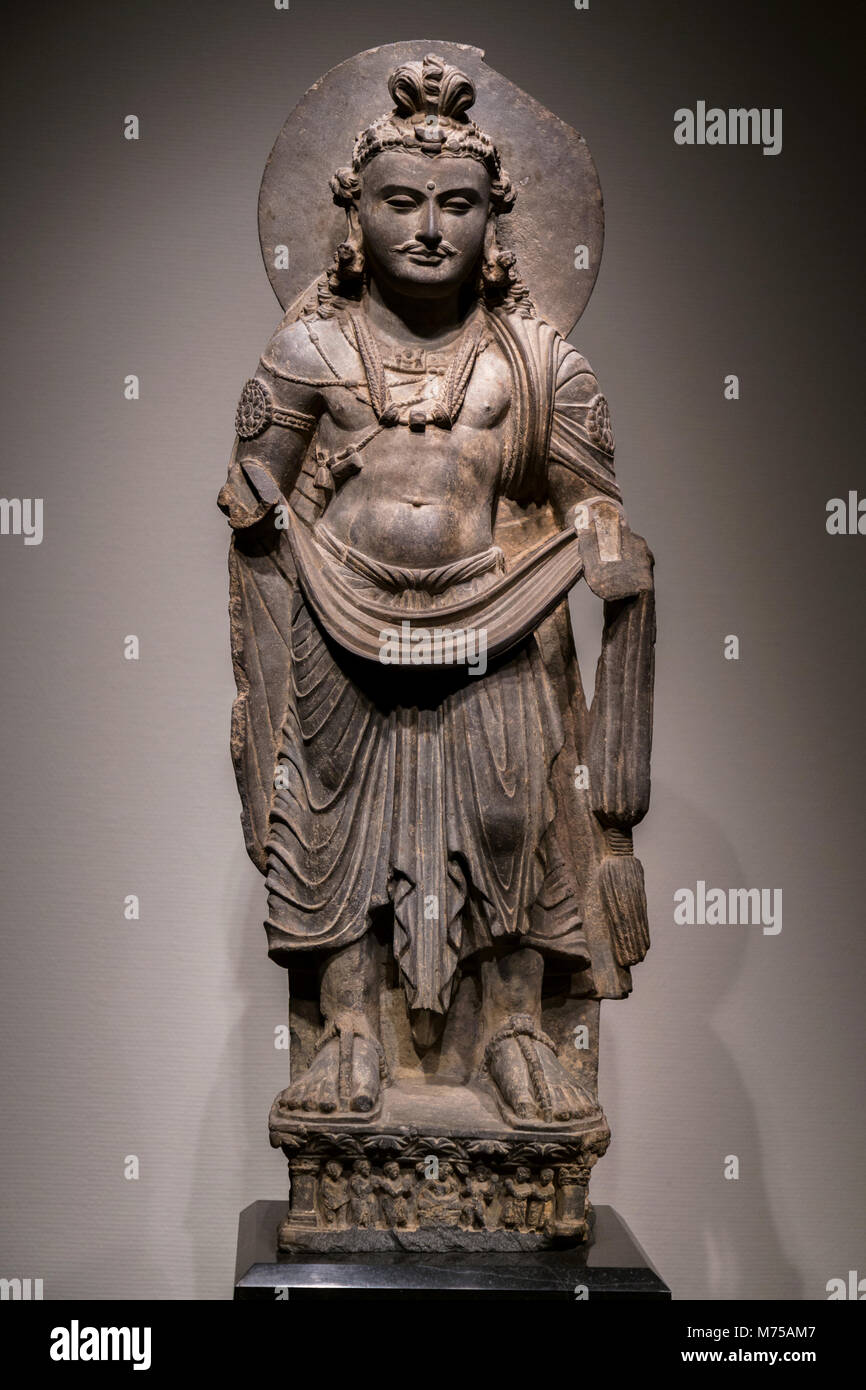 ancient Standing Bodhisattva schist statue image in 2nd century, Kushan dynasty from Gandhara, Pakistan. Stock Photo