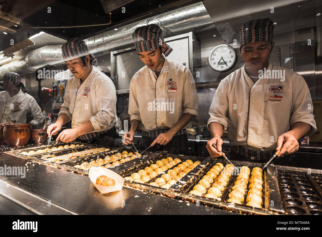 Tokyo, Japan January 17, 2018 japanese chefs are cooking takoyaki