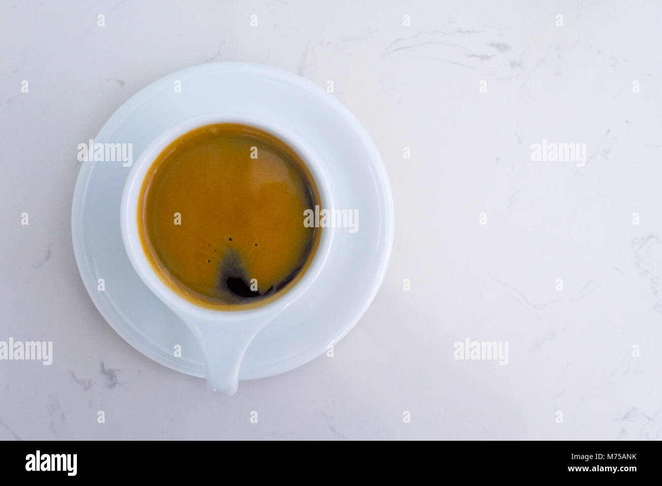 americano coffee cup and plate on the white marble table in the morning time. top view and copy space. Stock Photo