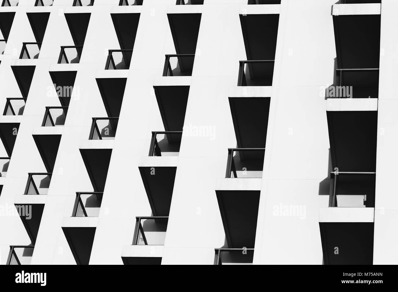 beautiful light and shadow on building balconies of the vintage hotel at the summertime. black and white photo of architecture design. Stock Photo