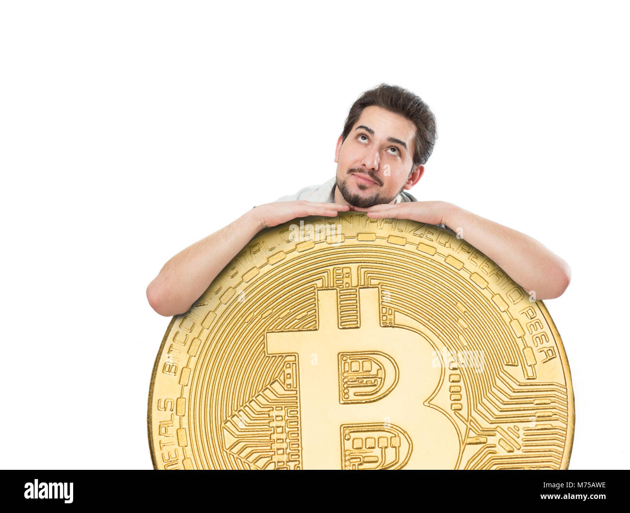 A cheerful man with a big joyful smile holding a huge bitcoin coin on a  white background Stock Photo - Alamy