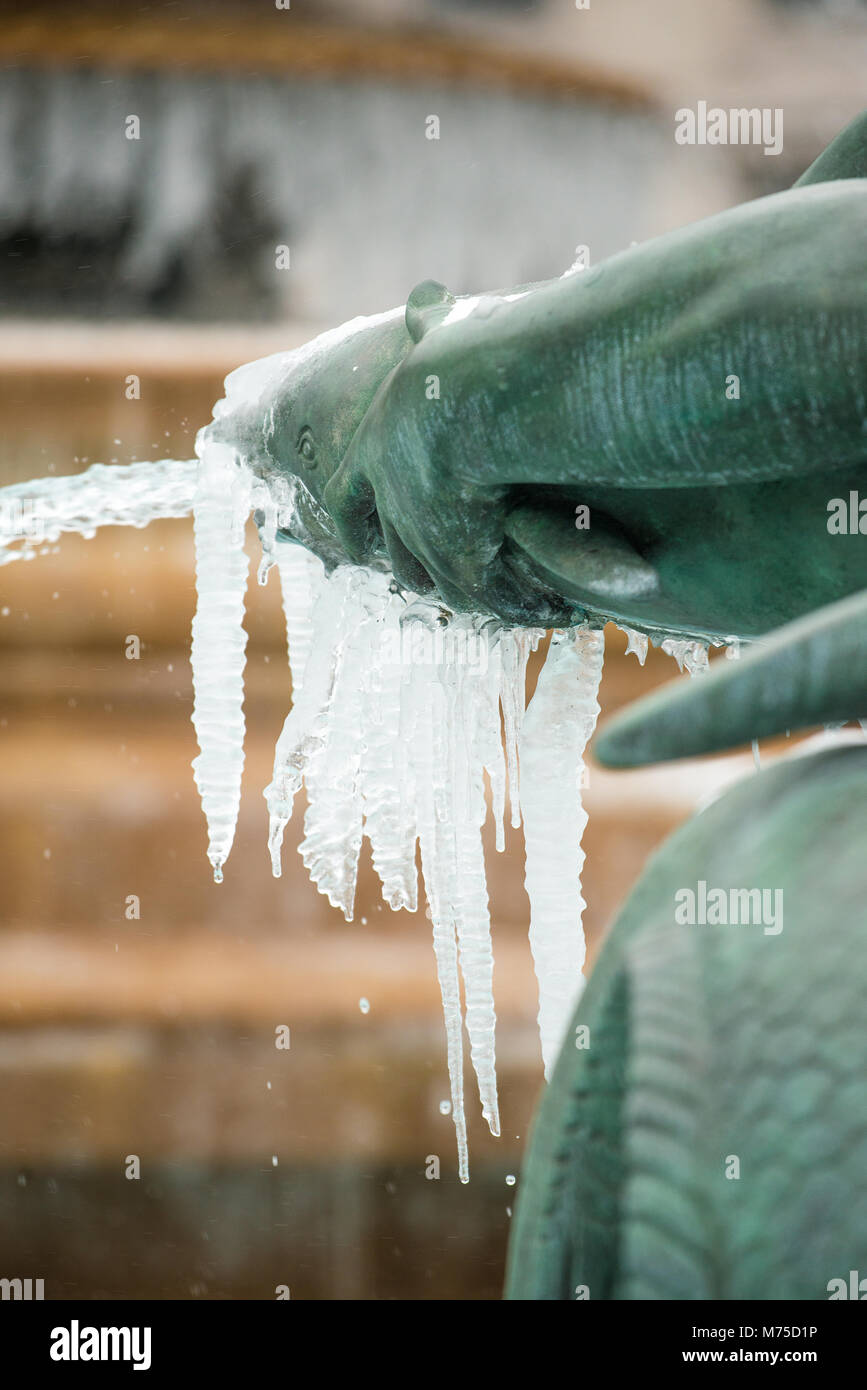 The fountains and water sculptures at Trafalgar Square, London, stand frozen and covered in ice, after recent severe winter weather hit the capital. Stock Photo