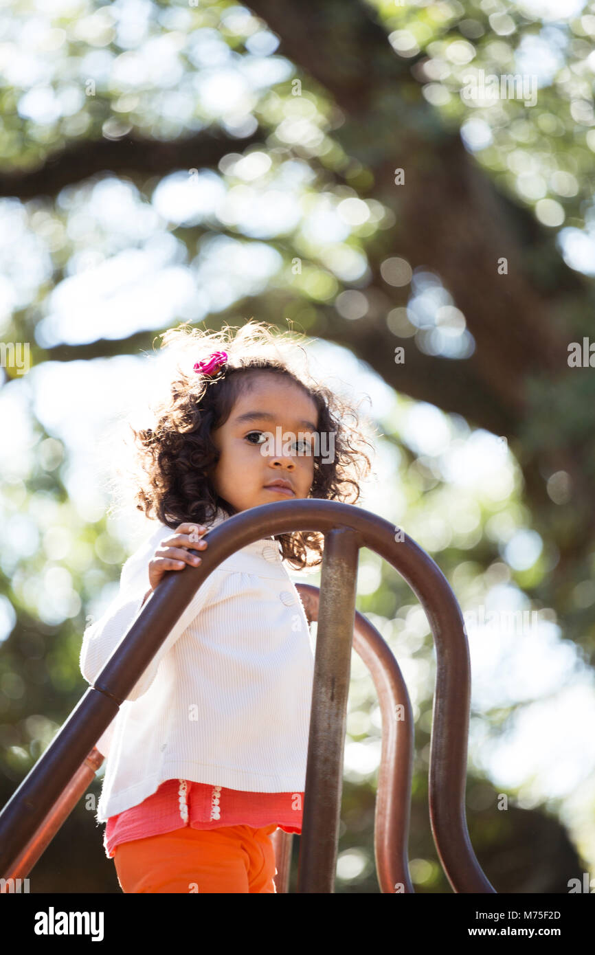 Little girl playing at the park Stock Photo - Alamy